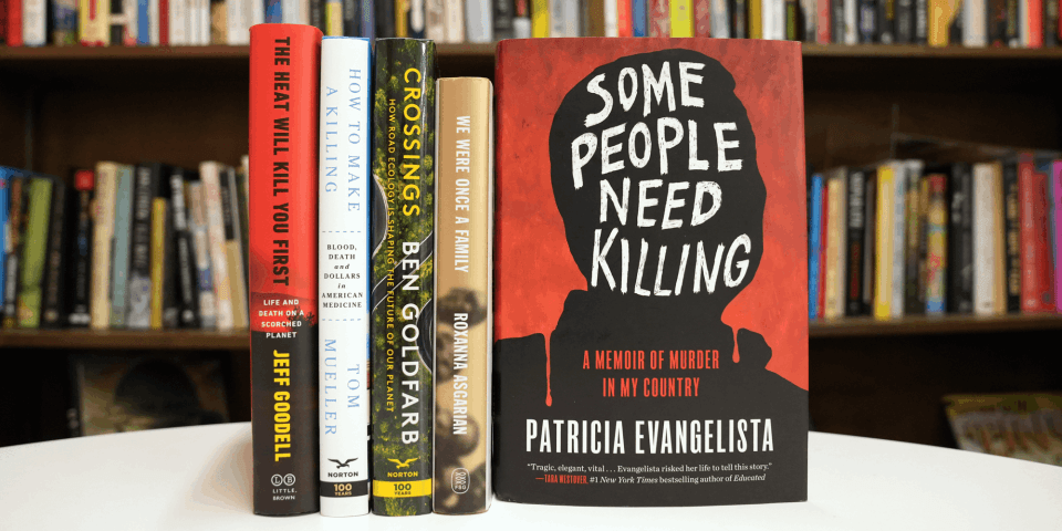 five books on a table with Some People Need Killing's cover shown