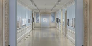 Photograph of exhibition showing entryway and both sides of the Print Gallery corridor