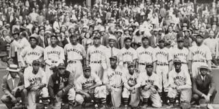 1939, American Negro League Baseball team, NY Black Yankees, team portrait in front of crowded stands - COPYRIGHT MORGAN and MARVIN SMITH