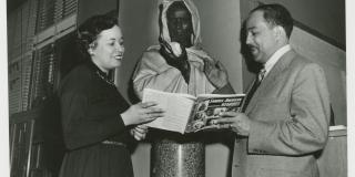 Black and white photo of Jean Blackwell Hutson and Langston Hughes.