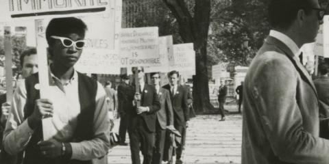 Ernestine Eckstein in a picket line with sign