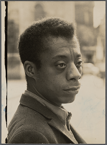 Photographic portrait of James Baldwin.